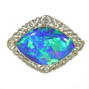 Antique Cosmic Dance: 24ct Black Opal Brooch from 1920